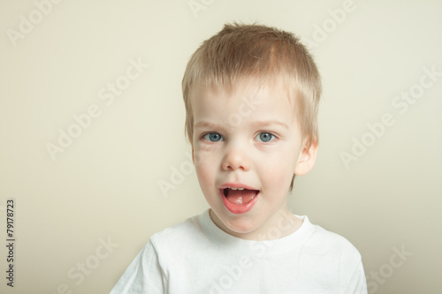 adorable blond toddler laughing