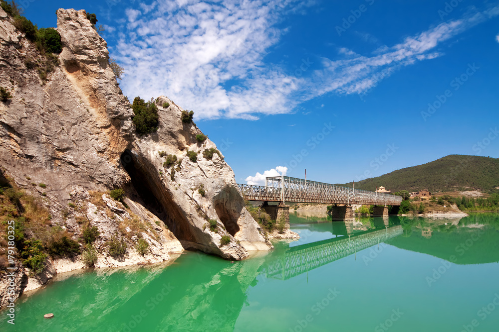 Bridge over River Gallego, province Aragon, Spain.Reservoir Rena