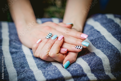 Girl shows blue manicure