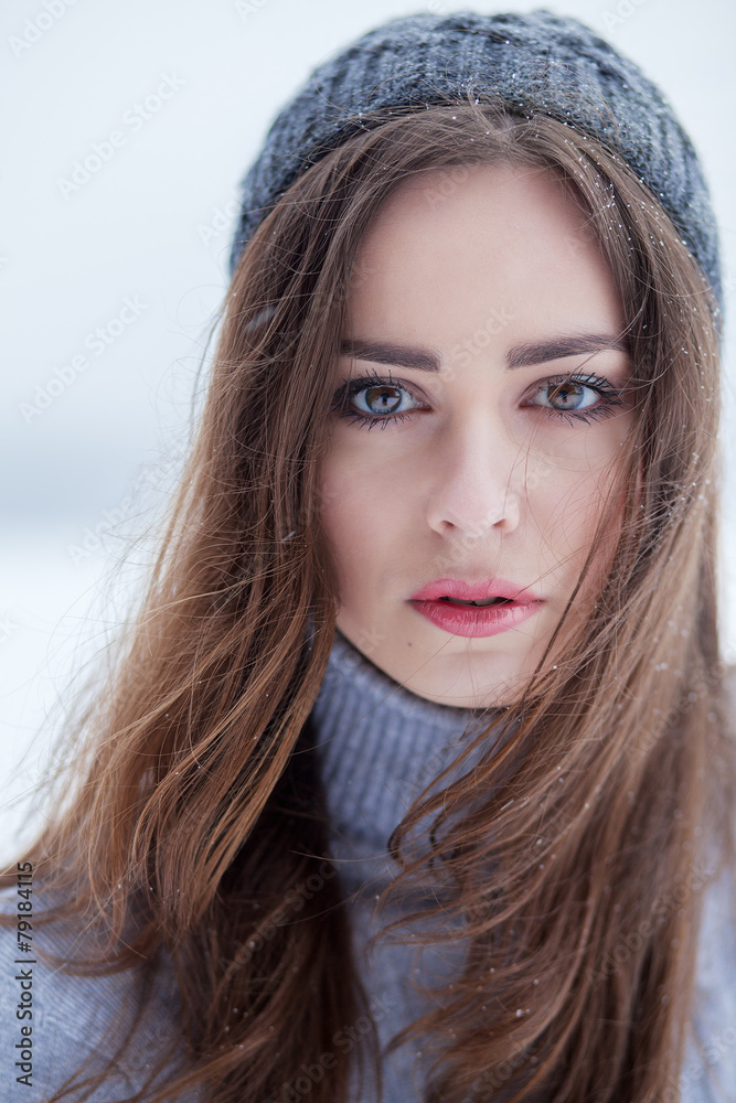 beautiful brunette girl in winter hat hipster