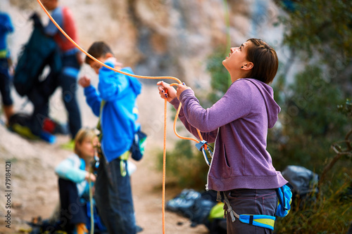 belayer with the rope and carabines photo