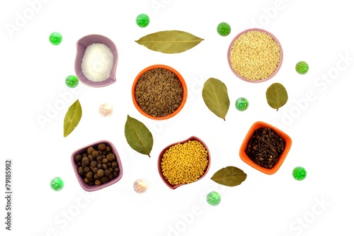 Various kinds of spices in tiny cups