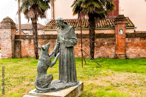 Schilderij op canvas Statue of Saint Francis and the wolf