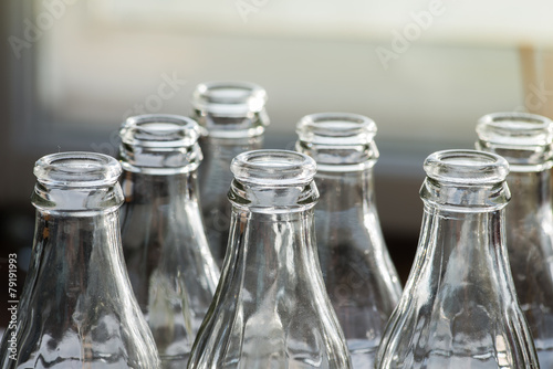 Clear glass bottles in the sun