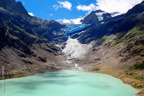 Lake and Glacier Trift, view from bridge for hanging in Alps. Ca photo