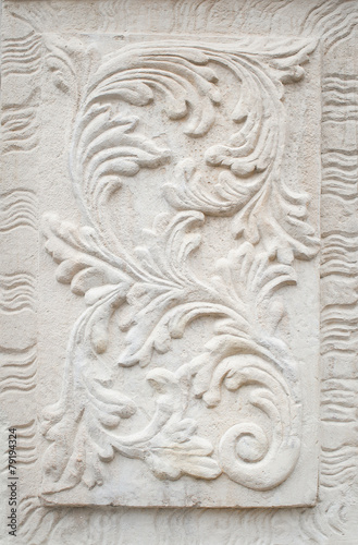 white plaster on the wall, a bas-relief