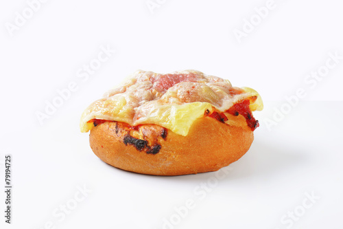 Cheese and ham topped bread bun