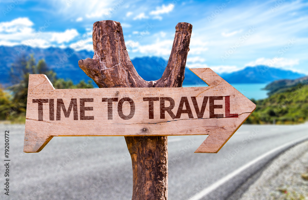 Time to Travel wooden sign with road background