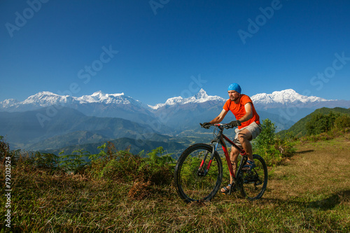 Biker-boy in Himalaya mountains, Anapurna region © Maygutyak