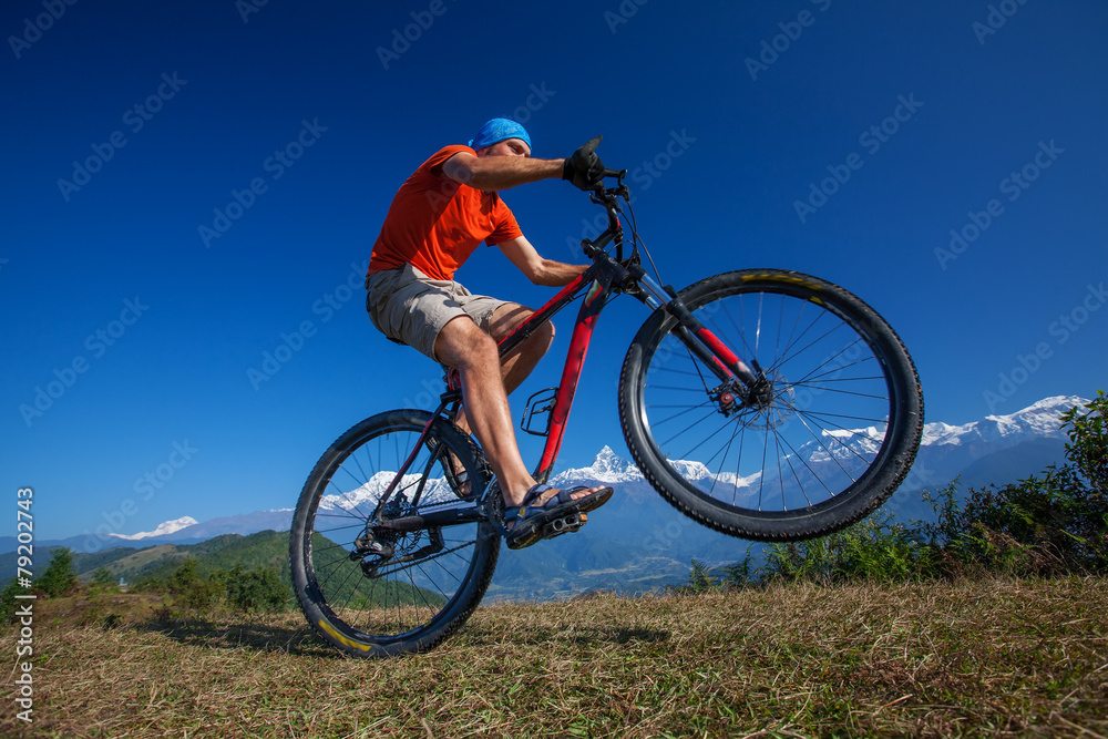 Biker-boy in Himalaya mountains, Anapurna region