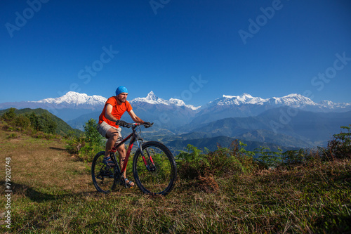 Fototapeta Naklejka Na Ścianę i Meble -  Biker-boy in Himalaya mountains, Anapurna region