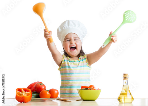 smiling little girl in cook...