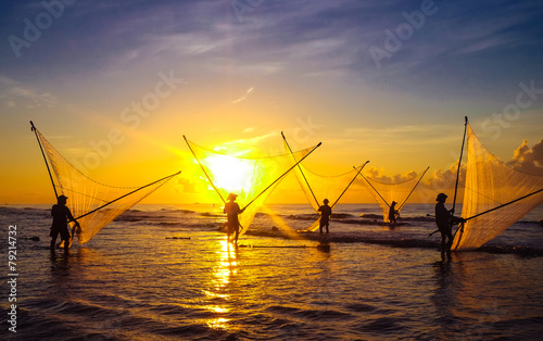 Fishermen fishing in the sea at sunrise in Namdinh, Vietnam