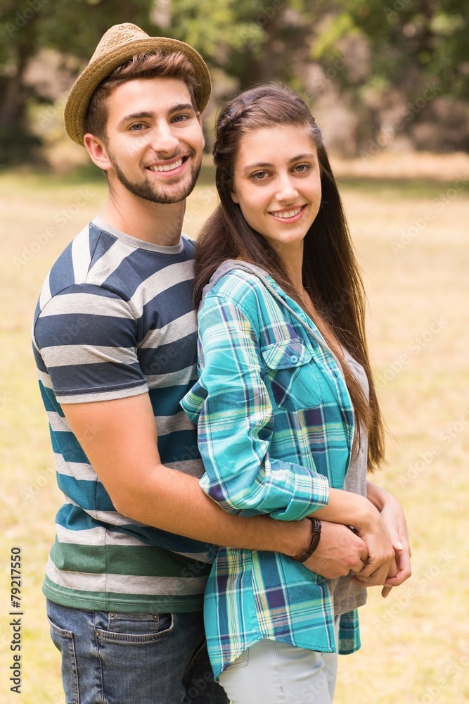 Fototapeta premium Young couple hugging in the park