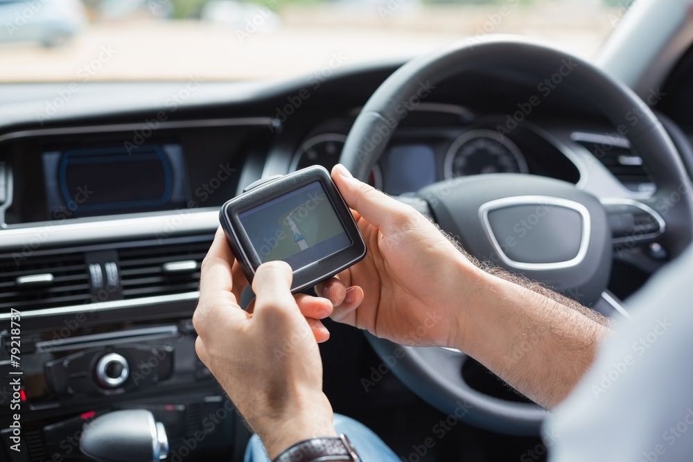Man using satellite navigation system Man using satellite navigation system