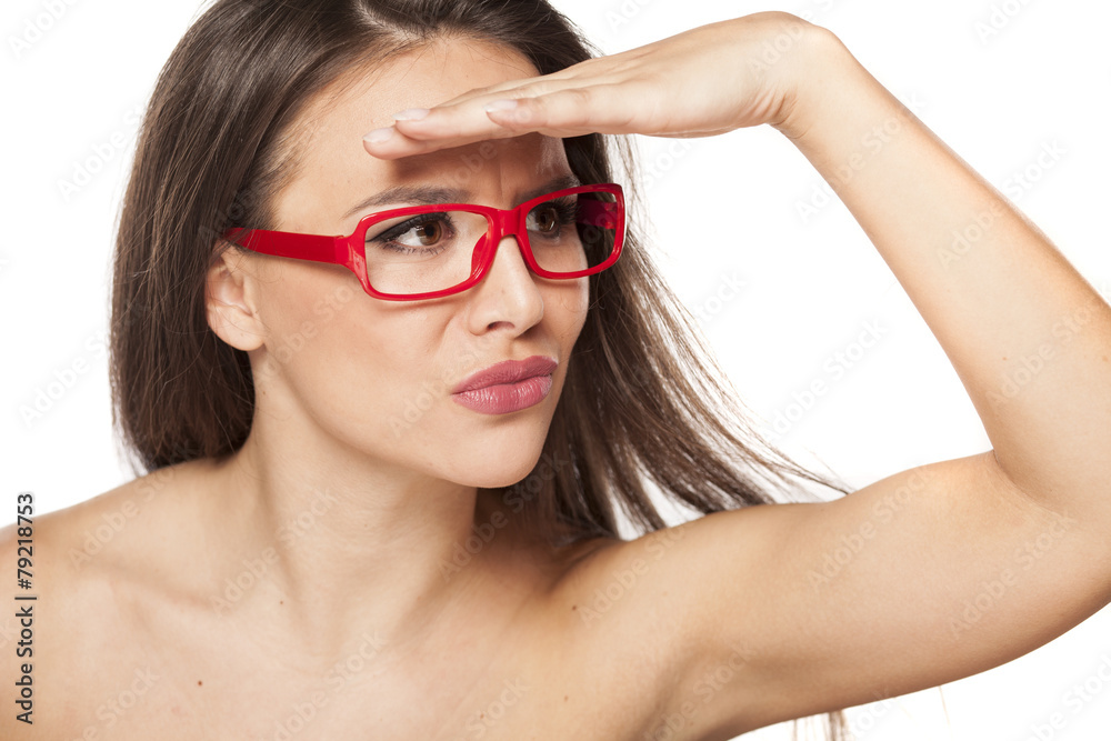 beautiful young woman with glasses looks into the distance beautiful young woman with glasses looks into the distance