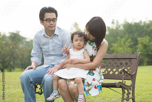 Happy Asian Family enjoying their time in the park © wong yu liang