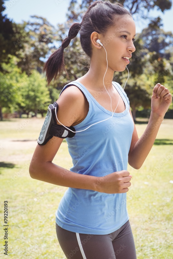 Fit woman jogging in the park Fit woman jogging in the park