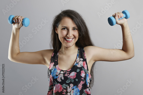 Cheerful fit woman exercising