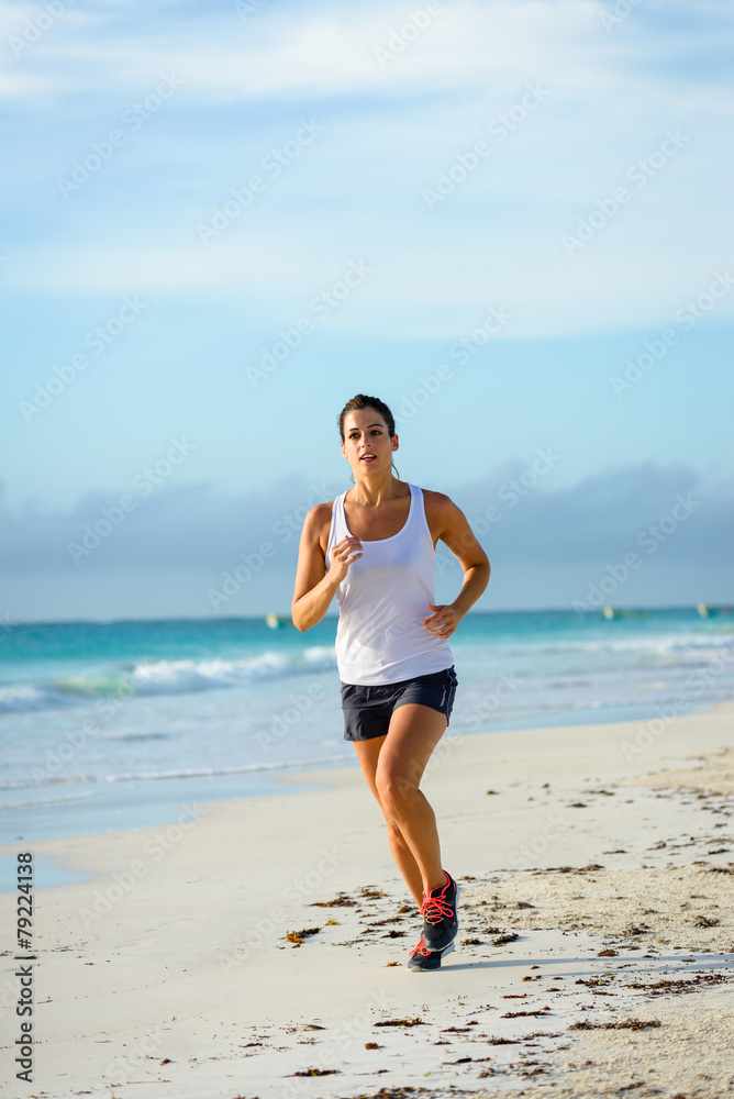 Woman running at beach Woman running at beach