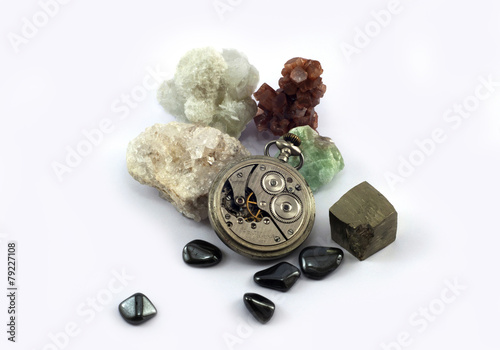 Old pocket watch and gemstones photo