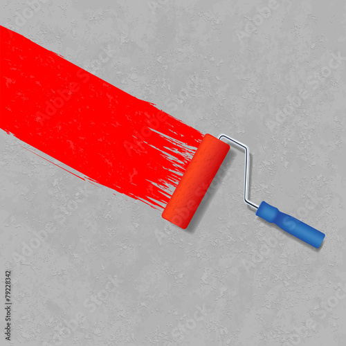 paint roller and a gray concrete wall