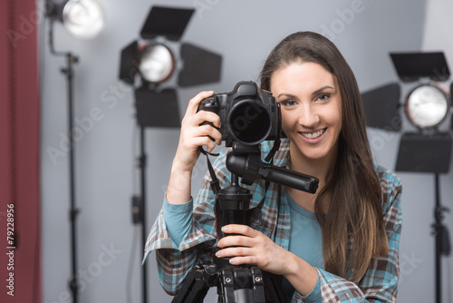 Young photographer posing