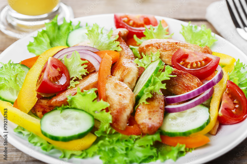 Salad with grilled chicken fillet tomatoes peppers and cucumber Salad with grilled chicken fillet tomatoes peppers and cucumber
