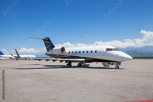Business jet airplane on the ground.