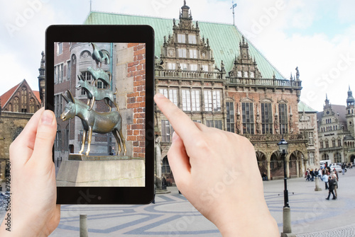 tourist taking photo of Bremen Town Musicians photo