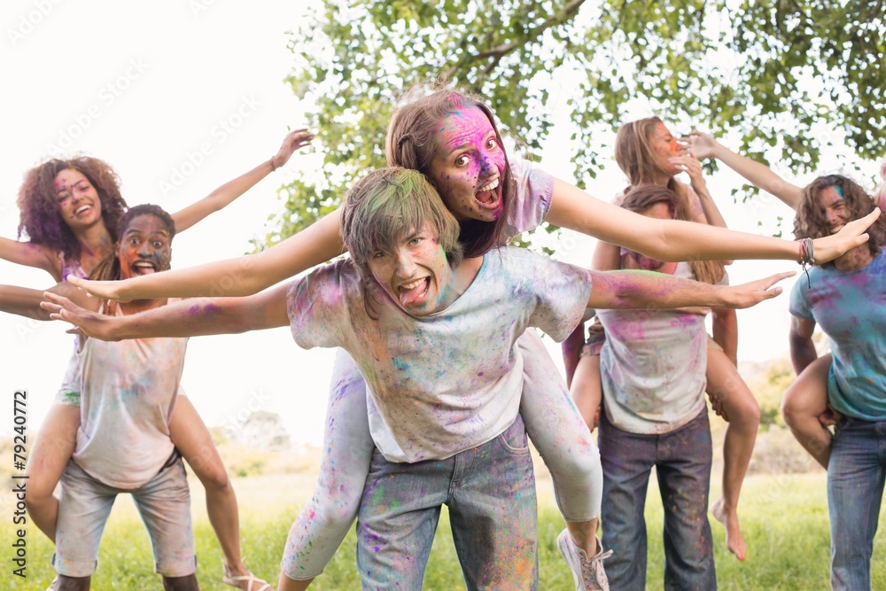 Happy friends covered in powder paint Happy friends covered in powder paint