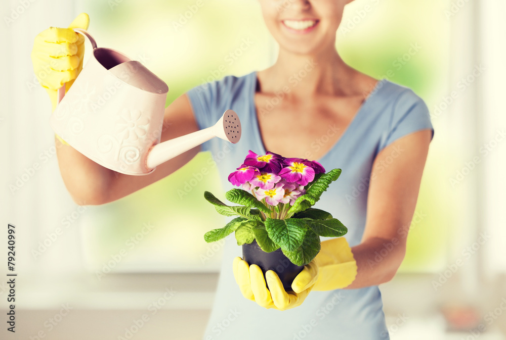 woman holding pot with flower