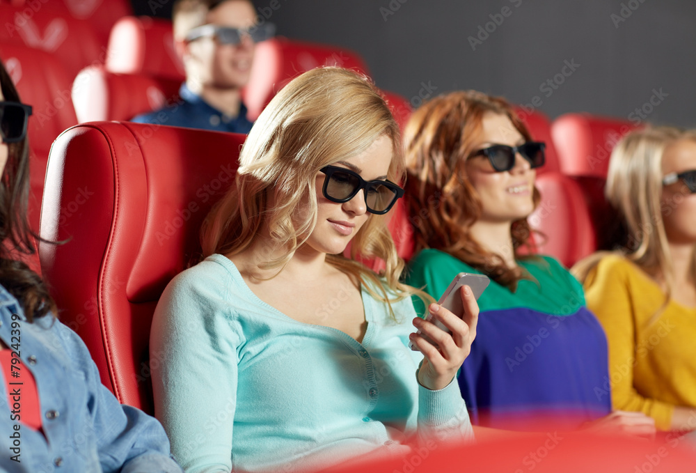 happy woman with smartphone in 3d movie theater