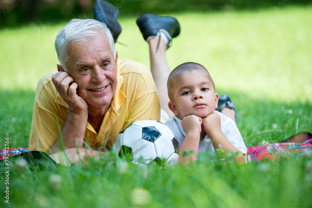 grandfather and child have fun in park grandfather and child have fun in park