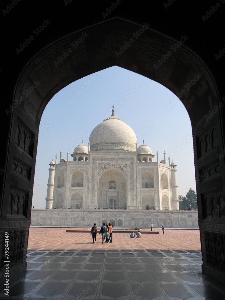 Naklejka premium Taj Mahal from an arched portal of adjacent mosque
