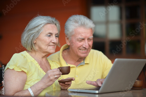 couple sitting with laptop