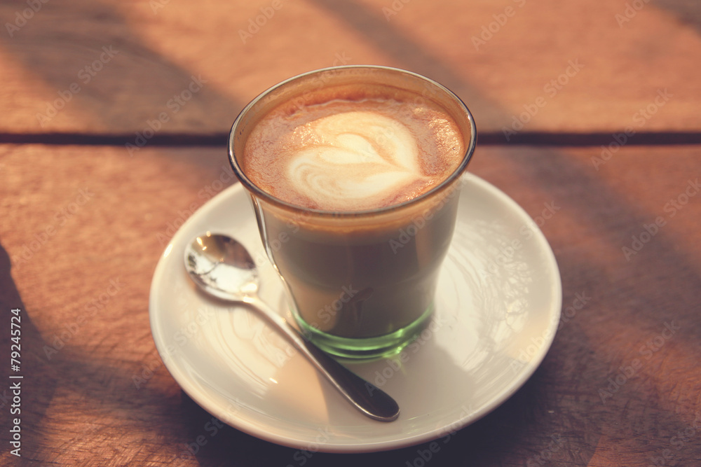Coffee latte art on the wood texture background - Vintage effect Coffee latte art on the wood texture background - Vintage effect