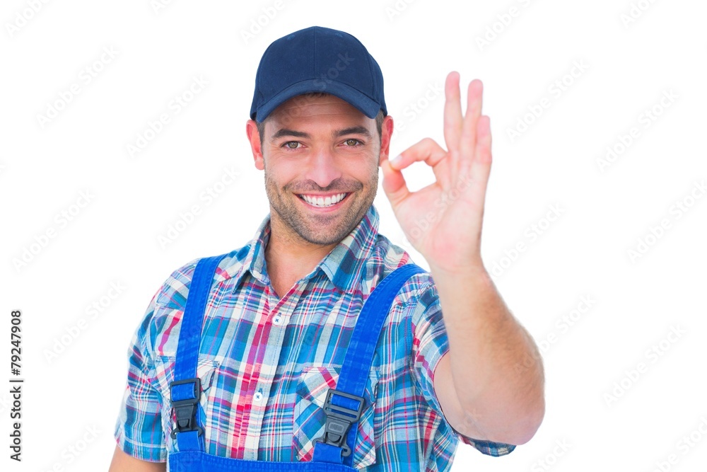 Portrait of smiling repairman gesturing okay Portrait of smiling repairman gesturing okay