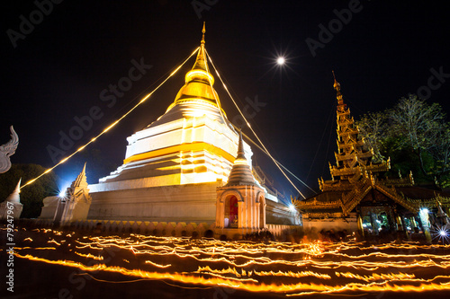 Candle lit in makha bucha day  at Wat Phra That Lampang Laow  photo