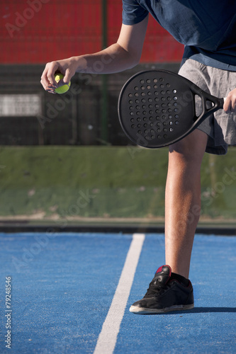 Teen playing paddle photo