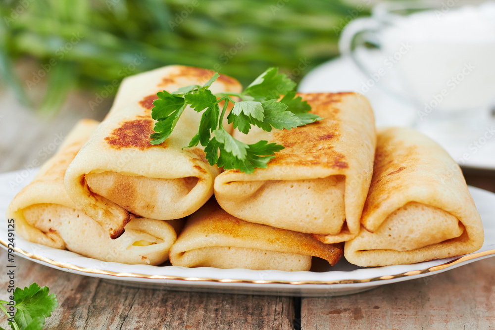 Stuffed pancakes crepes with meat and sauce Stuffed pancakes crepes with meat and sauce