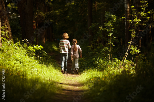 Boy with a girl go through the woods © dimedrol68