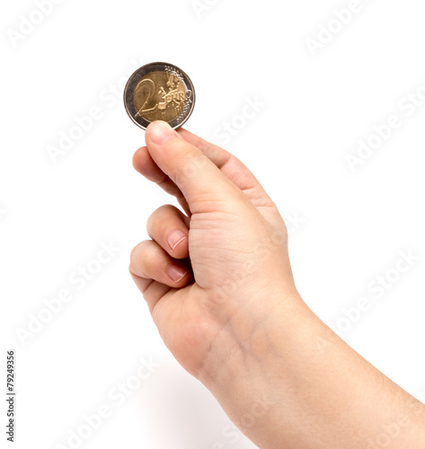 Two euro coin in child hand