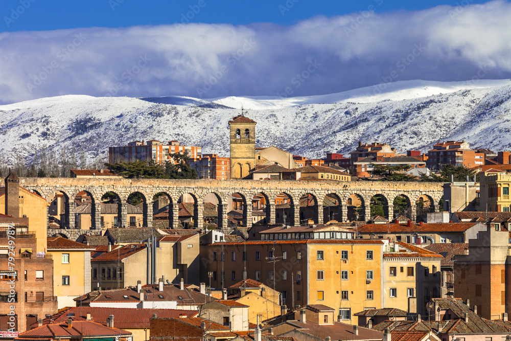 view of Segovia with roma aqueduct and mountains