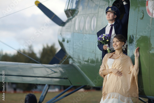 Wedding couple in love vintage aircraft photo