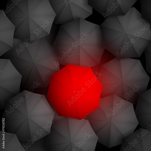 red umbrella on a background of black umbrellas