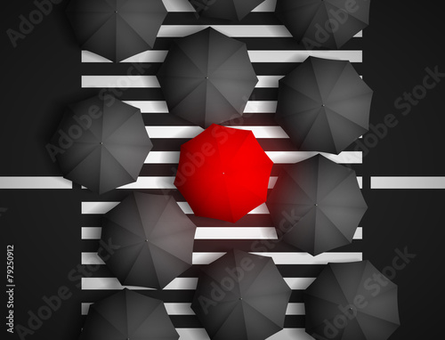 red umbrella and black umbrellas on a background of a pedestrian