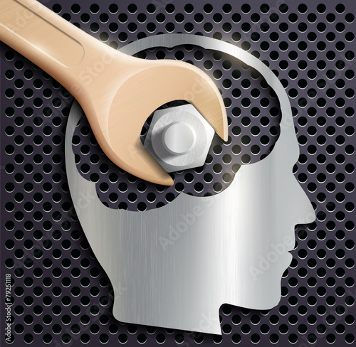 human head and a wrench with a nut