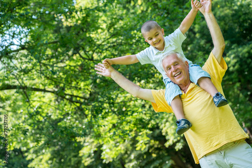 grandfather and child have fun in park