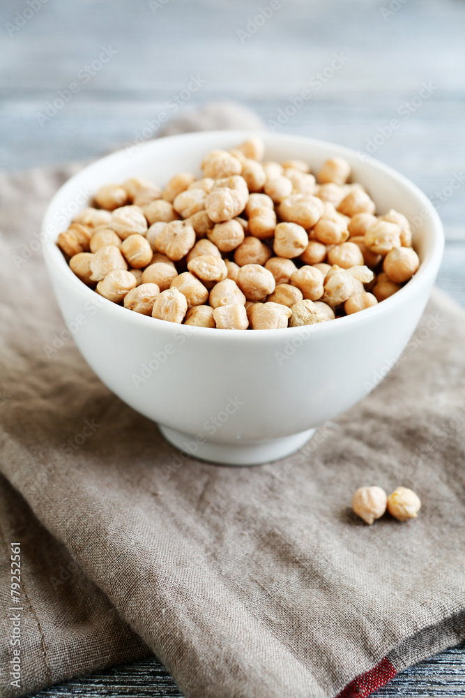 Uncooked chickpea in a white bowl Uncooked chickpea in a white bowl